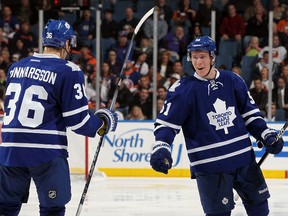 Maple Leafs rookie defenceman Jake Gardiner (right) celebrates the first goal of his National Hockey League career with teammate Carl Gunnarsson, a third-period marker at Nassau Coliseum that tied last night’s game against the New York Islanders 2-2. (AFP)