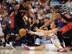 Raptors’ Rasual Butler (left) and DeMar DeRozan double team Blake Griffin of the Clippers during a game in Los Angeles on Sunday. The Raptors continue their five-game road swing with an encounter against the Suns in Phoenix on Tuesday night. (AFP files)