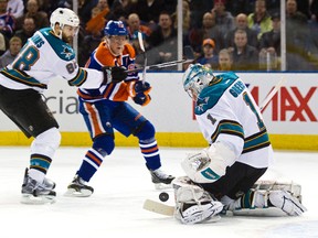 Ales Hemsky follows the puck as Sharks goalie Thomas Greiss makes the stop during first-period action at Rexall Place Monday. (Codie McLachlan, Edmonton Sun)