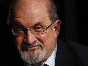 Author Salman Rushdie poses for a photograph after an interview with Reuters in central London in this October 8, 2010 file photo. (REUTERS/Andrew Winning/Files)