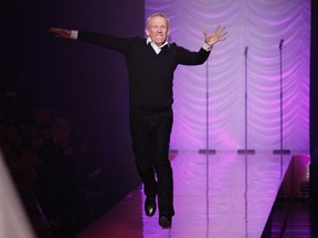 French designer Jean Paul Gaultier jumps on the runway at the end of his Haute Couture Spring-Summer 2012 fashion show in Paris January 25, 2012.  (REUTERS/Gonzalo Fuentes)