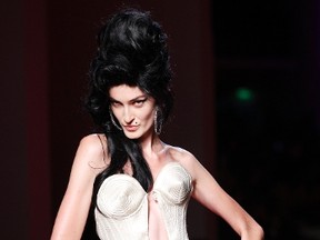 A model presents a creation by French designer Jean Paul Gaultier as part of his Haute Couture Spring-Summer 2012 fashion show in Paris, Jan. 25, 2012.  (REUTERS/Gonzalo Fuentes)