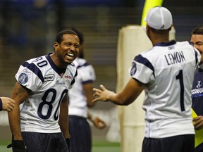 Argos receiver Jeremaine Copeland yucks it up with his former QB, Cleo Lemon, during a team workout. Copeland announced his retirement Wednesday and joined the Hamilton Tiger-Cats as their receivers coach. (REUTERS)