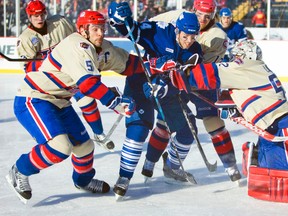 Marlies forward Will Acton tries to break through the Bulldogs defence during the AHL Outdoor Classic at Ivor Wynne Stadium in Hamilton, Ont., Jan. 21, 2012. (ERNEST DOROSZUK/QMI Agency)