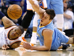 Thunder guard Russell Westbrook battles for a loose ball against Nuggets forward Danilo Gallinari at Chesapeake Energy Arena in Oklahoma City, Okla., April 17, 2011. (BILL WAUGH/Reuters)