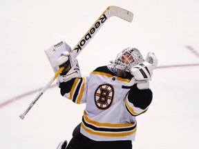 Bruins goalie Tim Thomas made the unusual move of mixing politics with pucks, but he’s certainly not the first athlete to take a stand. (TIM SAFFER/Reuters files)