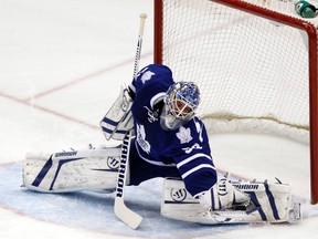 Maple Leafs goalie Jonas Gustavsson makes a sprawling save against the Islanders. The Monster made 29 saves for the win. (Reuters)