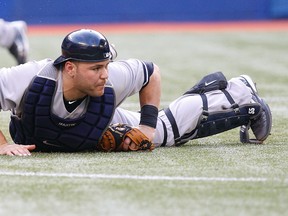 Yankees catcher, Russell Martin reacts after failing to make a play against the Blue Jays at the Rogers Centre in Toronto, Ont., July 14, 2011. (CRAIG ROBERTSON/QMI Agency)