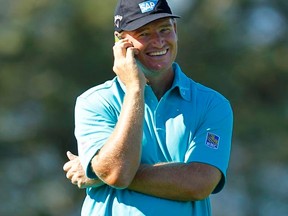 South African golfer Ernie Els talks on a phone before playing in the Pro-Am at the Farmers Invitational in San Diego on Wednesday, Jan. 25, 2012. (REUTERS/Mike Blake)