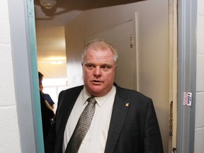 Mayor Rob Ford tours a TCHC buidling at 101 Humber Blvd. in this file photo. Ford looked at its general condition and went into some units to talk with tenants. (Craig Robertson/TORONTO SUN)