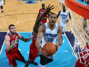 Hornets guard Eric Gordon goes to the basket under pressure against the 76ers at the New Orleans Arena in New Orleans, La., Jan. 4, 2012. (LAYNE MURDOCH/NBAE via Getty Images/AFP)