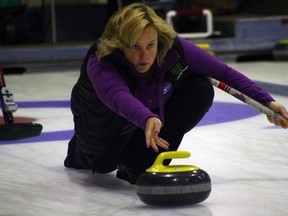 Cathy Auld delivers a rock against the Horgan rink at the Ontario Scotties Tournament of Hearts at the Kenora Curling Club in Kenora, Ont., Jan. 24, 2012. (GARETT WILLIAMS/QMI Agency)