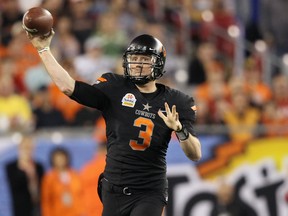 Oklahoma State quarterback Brandon Weeden has looked terrific during workouts for the Senior Bowl in Mobile, Ala. But he's 28 and that could hurt his chances of being taken early in the NFL draft. (GETTY IMAGES)