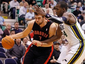 Raptors forward Andrea Bargnani drives past Jazz forward Paul Millsap during last night’s game in Salt Lake City. Toronto came back to win in overtime. (REUTERS)