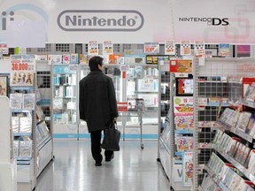 A man walks past Nintendo Co. Ltd.'s video game software titles at a Yamada Denki electronics retail store in Tokyo Jan. 26, 2012. REUTERS/Toru Hanai