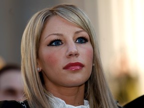 Model Angelica Marie Cecora listens to questions by media members when she leaves the Supreme Court in New York, Jan. 25, 2012. (REUTERS/Eduardo Munoz)