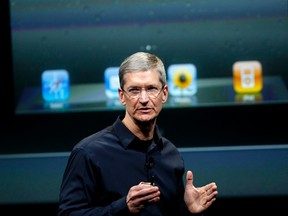 Apple CEO Tim Cook speaks about the iPhone 4S at the Apple headquarters in Cupertino, Calif. in this Oct. 4, 2011 file photo.     REUTERS/Robert Galbraith/Files
