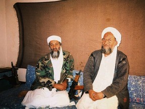 Osama bin Laden (L) sits with adviser Ayman al-Zawahri during an interview with Pakistani journalist Hamid Mir in this November 2001 file photo. (REUTERS)