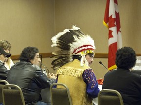 Chief Leon Chalifoux (in headgear) of the Swan River First Nation spoke at the Northern Gateway pipeline hearings in Edmonton Thursday. (IAN KUCERAK/Edmonton Sun)
