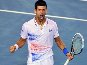 Novak Djokovic celebrates breaking serve against Andy Murray during their men's semifinal match at the Australian Open in Melbourne on Friday, Jan. 27, 2012. (REUTERS/Toby Melville)