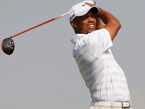 Tiger Woods watches his shot from the third tee during the second round of the Abu Dhabi Championship on Friday, Jan. 27, 2012. (REUTERS/Nikhil Monteiro)