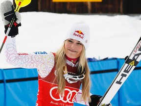Lindsey Vonn celebrates after winning the women's super combined race in St. Moritz on Friday, Jan. 27, 2012. (REUTERS/Pascal Lauener)