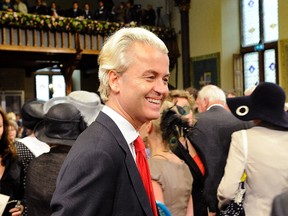 Geert Wilders, leader of the Dutch political Party for Freedom, smiles before the presentation of the Dutch 2012 Budget Memorandum and the opening of the Dutch Parliamentary Year in the Hague September 20, 2011.  (REUTERS/Toussaint Kluiters/United Photos)