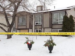 The Winnipeg house where a fire killed four people and left a baby girl clinging to life Jan. 24, 2012. (JASON HALSTEAD/QMI AGENCY)