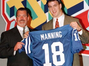 Colts owner Jim Irsay (left) poses with Peyton Manning after the quarterback was selected first overall in the 1998 NFL draft. (Mike Segar/Reuters/Files)