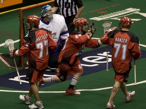 The Calgary Roughnecks celebrate a goal during their 12-9 win over the Rock in Toronto's home-opener. The Rock expect a better effort in the rematch Saturday night in Calgary. (JACK BOLAND/Toronto Sun)