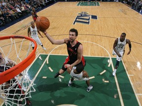 Raptors' Andrea Bargnani goes to the net during Wednesday's win over Utah. He re-injured his calf muscle during the overtime and is out of the lineup for an extended period. (GETTY IMAGES)