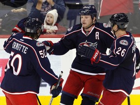 Columbus Blue Jackets' Derek Dorsett celebrates after scoring a goal with teammates Antoine Vermette and Samuel Pahlsson during the third period of their NHL hockey game against the Edmonton Oilers in Columbus, Ohio Jan. 17, 2012. (REUTERS/Matt Sullivan)