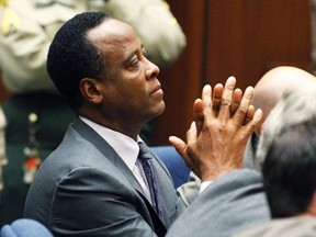 Dr. Conrad Murray sits in court after he was sentenced to four years in county jail for his involuntary manslaughter conviction of pop star Michael Jackson in Los Angeles November 29, 2011. (REUTERS/Mario Anzuoni)
