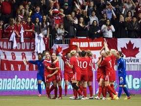 Team Canada celebrates after defeating Mexico to qualify for the 2012 Olympics after their semifinal CONCACAF Women's Olympic qualifying soccer match in Vancouver, British Columbia January 27, 2012. (REUTERS/Ben Nelms)