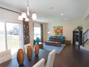 Light floods a large dining area floating between a spacious kitchen and great room.