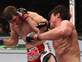 Chael Sonnen (right) punches Michael Bisping during the UFC on FOX 2 event on Saturday in Chicago. Sonnen won to set up a match with Anderson Silva. (Nick Laham/Zuffa LLC via Getty Images)