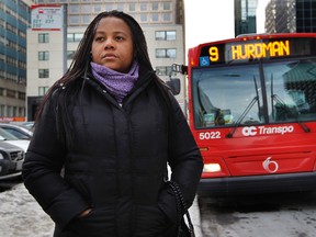 Ndjiwa Yakibonge stands by her bus stop on Kent St. in Ottawa Thursday, January 26, 2012. Yakibonge wishes that OC Transpo would add more runs for rural riders.  (Tony Caldwell/QMI Agency)