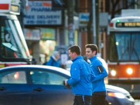 Two men jog at Queen St. and Spadina Ave. during the weekend. (ERNEST DOROSZUK, Toronto Sun)
