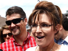 Former Governor of Alaska Sarah Palin and her husband Todd visit the Iowa State Fair in Des Moines, Iowa, August 12, 2011.  (REUTERS/Jim Young)