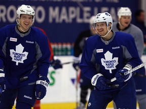 Leafs teammates Nikolai Kulemin (left) and Mikhail Grabovski, who is the subject of ongoing trade speculation, share a laugh as the team gets back to business following the all-star break.