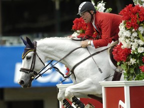 Ian Millar puts his horse through his paces at an equestrian event at Spruce Meadows. The Pan Am site selection for the 2015 equestrian events is the focus of controversy. (QMI Agency files)