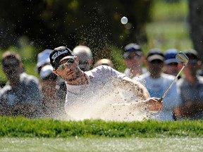 Kyle Stanley of the U.S. hits out of the bunker on the sixth hole on the south course at Torrey Pines during final round play at the Farmers Open PGA tournament in San Diego, Sunday. (REUTERS)