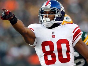 Giants receiver Victor Cruz gestures after catching a pass for a first down against the Packers during their NFC Divisional playoff game in Green Bay, Wisc., on Jan. 15, 2012. (REUTERS/Jeff Haynes)
