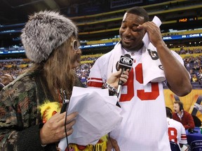 New York Giants defensive tackle Chris Canty is interviewed during media day for Super Bowl XLVI in Indianapolis Tuesday. The Giants are currently three-point underdogs. (REUTERS)