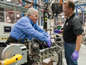 Under the guidance of General Motors experimental assembler Rich McBride (right), celebrated NASCAR team owner Rick Hendrick builds the engine that will go into his new Chevrolet Corvette Z06 Carbon Edition at the GM Performance Build Center in Wixom, Michigan. (REUTERS)
