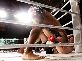 Antonio McKee takes Brian Cobb to the mat Friday during MFC 32: Bitter Rivals. Both McKee and Cobb, who were overwight for the event, have been cut by the organization. (Amber Bracken, Edmonton Sun)