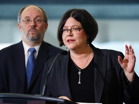 Lawyer, Freya Kristjanson, with Councillor Joe Mihevc  in background, provided a legal opinion that Mayor Rob Ford could not unilaterally kill Transit City. (Craig Robertson/Toronto Sun)