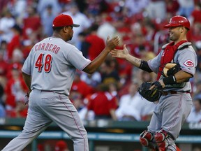 Jays' new set-up man, Francisco Cordero, (left) celebrates one of his 327 career saves during his most recent stint with the Cincinnati Reds. (REUTERS)