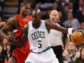Celtics' Kevin Garnett drives past Ed Davis of the Raptors last night.