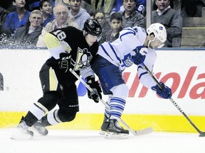 Leafs forward Clarke MacArthur gets away from Penguins winger James Neal during last night’s game at the Air Canada Centre. MacArthur scored the lone goal in the game to help the Leafs split a home-and-home series.